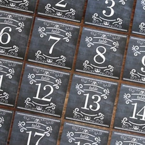 Packungen mit quadratischen rustikalen Tafelnummern für Hochzeiten - zwei Designs verfügbar