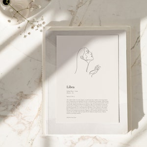 May include: A minimalist line art illustration of a woman's face with the text "Libra" and a description of the astrological sign. The text reads: "Ruling Planet: Venus, Home: September 23rd - October 22nd, Element: Air. Like a happy melody, the zodiac sign creates an undeniable aesthetic symphony. Their energy inspires peace. Compassionate and empathetic, she is a symbol of fairness and equality, subtly moving the tide and charming us each in turn. The zodiac constellation is a cornucopia of personalities. She has a refined taste and a strong sense of justice. She is a natural diplomat, a mediator, and a perfect grounder, very rarely being thrown off balance. She is blessed in her beauty and grace, and her charm is undeniable. She is a natural artist, a lover of beauty, and a lover of the finer things. She is always striving to be the epitome of elegance. Her spiritual energies may marry her perfectly grounded, very human core. She is magnified by the kind of magic you only find in people who are truly in touch with their inner selves. She is a symbol of balance, harmony, and courage. She is beautiful, simple and elegant like the brilliance of a simple harmony.  Perfectly balanced in all things she should be."