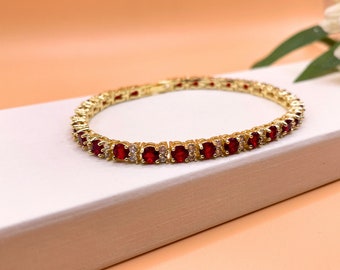 Yellow gold finish round cut red ruby with 2 tiny created diamond bracelet