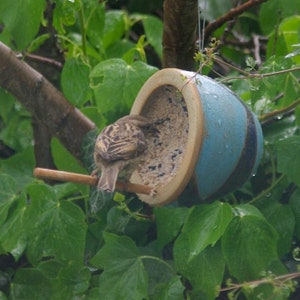 Handmade ceramic bird feeder for small garden birds, including food. image 3