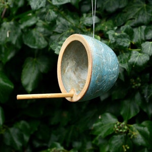 Handmade ceramic bird feeder for small garden birds, including food. image 2