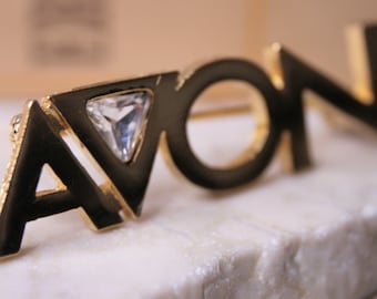 Spilla rappresentativa Avon Vintage color oro con strass