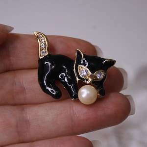 Black enamel rhinestone cat brooch Vintage black kitty with a ball