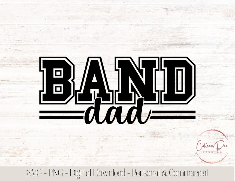 May include: Black and white graphic design with the words "BAND dad" in a collegiate font. The word "BAND" is in a bold, block letter style, and "dad" is in a cursive font. The design includes two horizontal lines below the word "dad".
