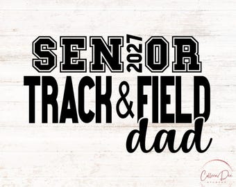 May include: A black graphic design featuring the text SENIOR 2027 TRACK & FIELD DAD. The word SENIOR is in a bold block font with the year 2027 vertically between the letters, followed by TRACK & FIELD in block letters and dad in script.