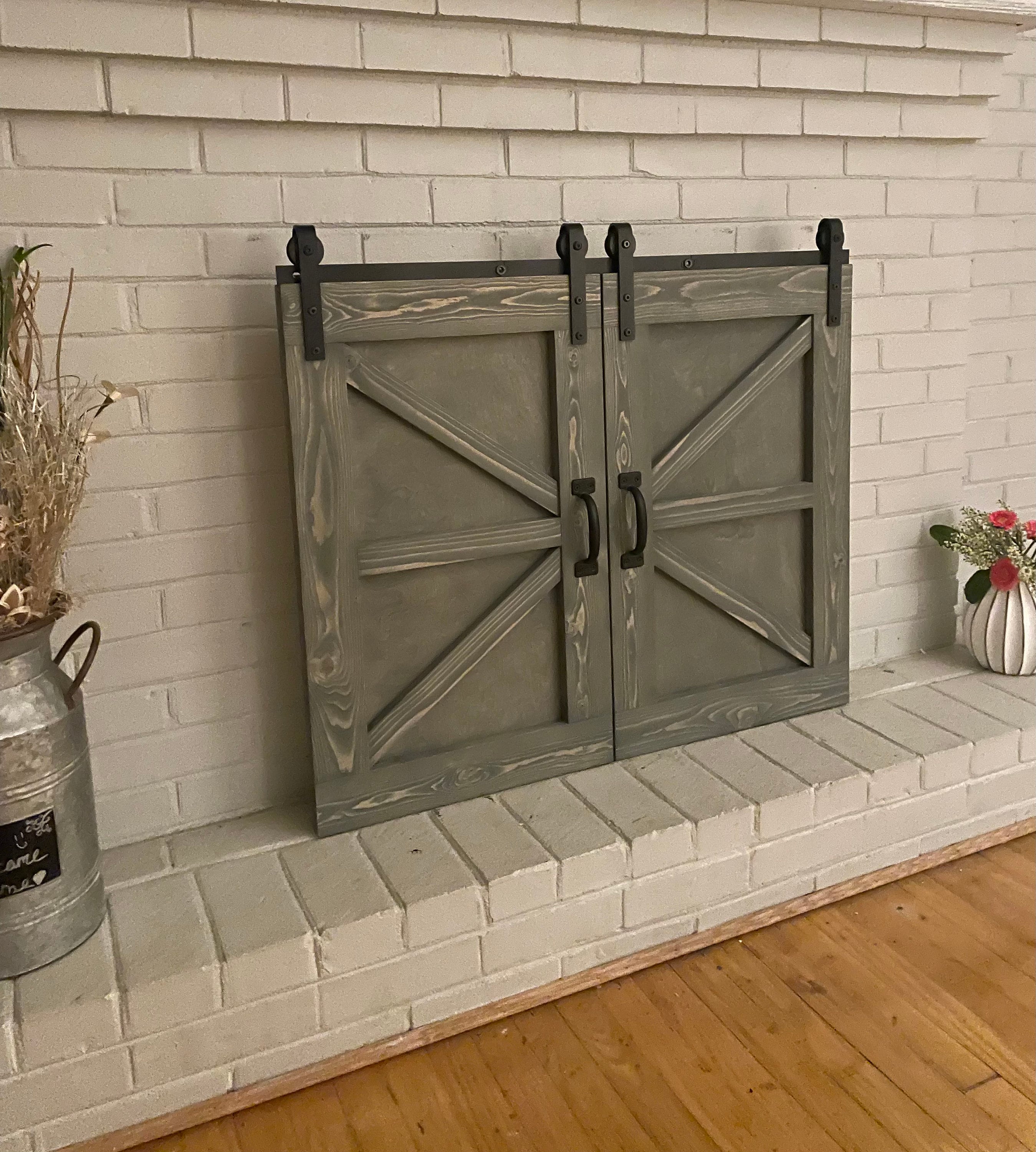 Fireplace with outlet sliding barn doors