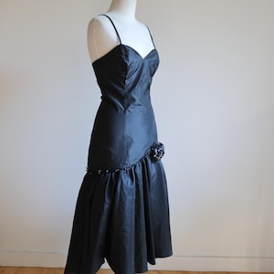 Black Flamenco Dress with Spaghetti Straps, Rosette, Silver Lace Detailing. Asymmetrical Skirt. US size 6.