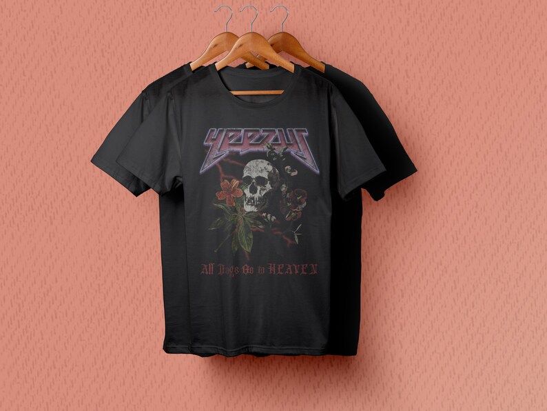 May include: Black t-shirt with a skull and floral design. The text "YEZZY" and "All Things Go to HEAVEN" are printed on the shirt.
