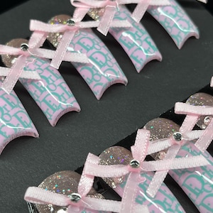 Coquette Press on nails| bow y2k classy nails| glitter nails| xxl nails| long press on nails| glue on nails| pink nails| bow ribbon coquette