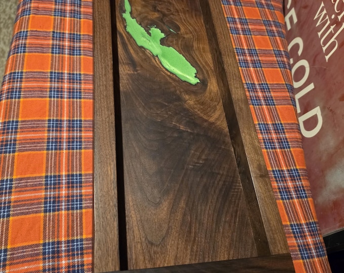 Custom black walnut valet tray with natural hole filled with green epoxy