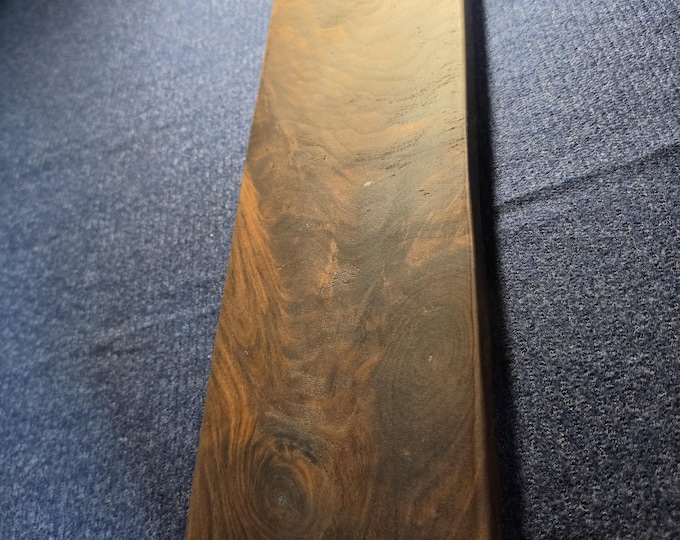 Custom Black walnut cutting/cheese board with tiny natural holes filled with light blue epoxy