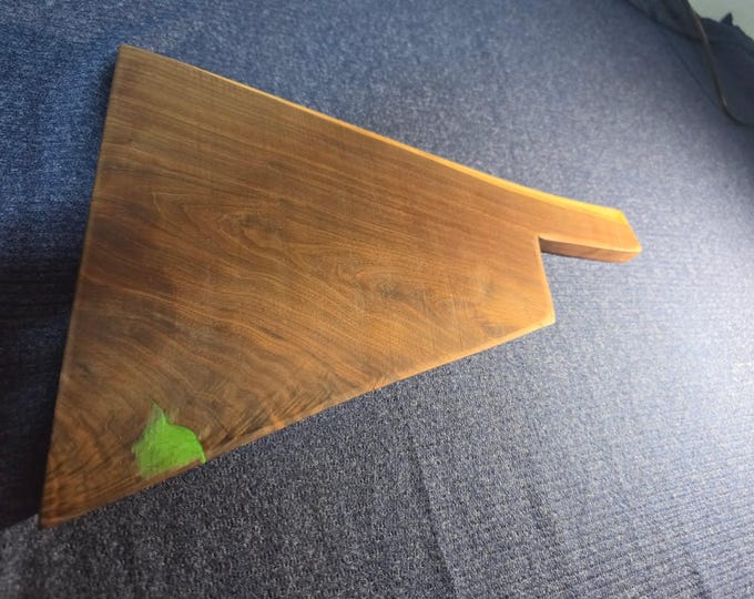 Custom Black walnut cutting board in the shape of a hatchet