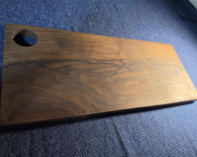 Custom Black walnut cutting/cheese board shocked & filled with maroon epoxy