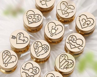 May include: Twelve gold heart-shaped wax seal stamps with various designs, including hearts, arrows, stars, and swirls.