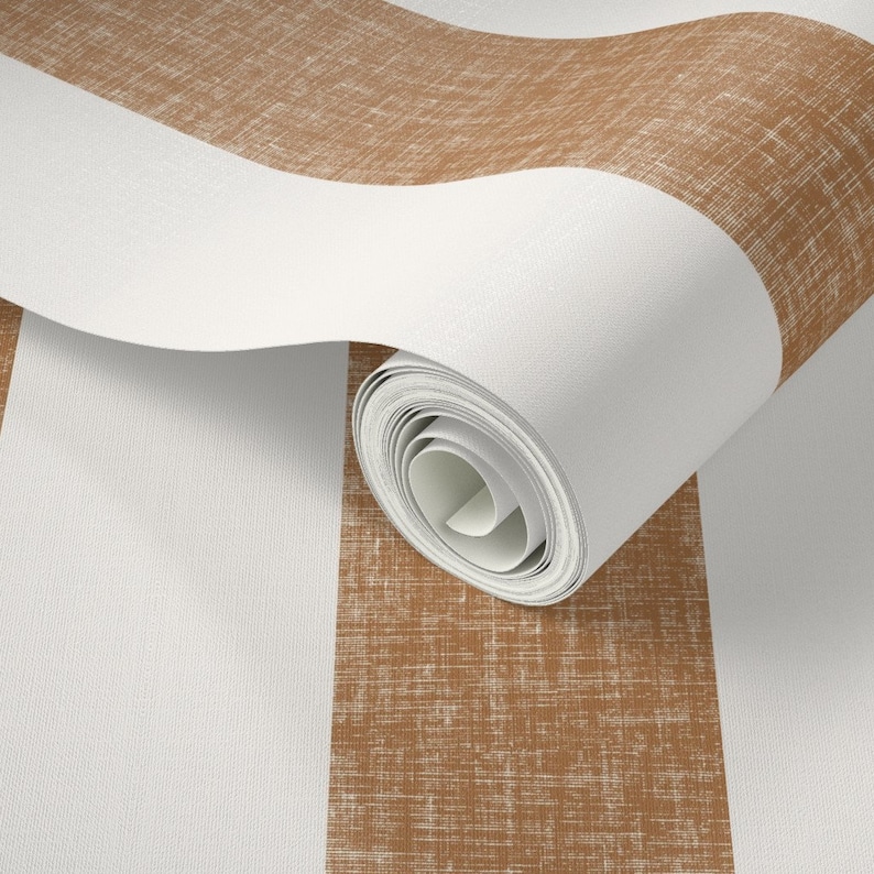 May include: A roll of brown and white striped wallpaper with a textured linen look. The wallpaper is rolled up and the stripes are visible.