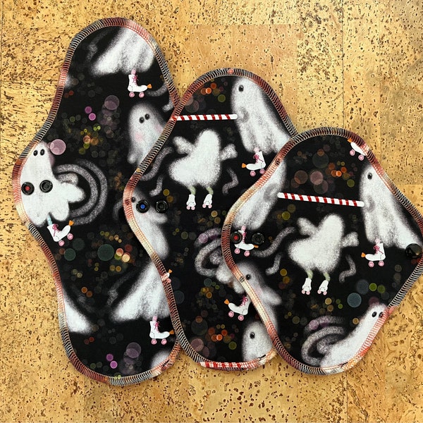 Serged Wrap Wing Skating Ghosts Bamboo Lycra topped cloth pad; multiple lengths and absorbencies