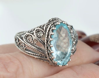 Anillo de cóctel para mujer con topacio azul en plata de ley 925, anillo de filigrana hecho a mano en plata maciza, anillo de regalo con alas de ángel y piedra natal de diciembre.