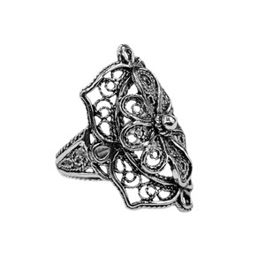 May include: A silver filigree ring with a floral design. The ring is intricate and delicate, with a raised center piece.