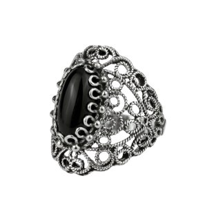 May include: A silver ring with a black oval gemstone set in a filigree design.