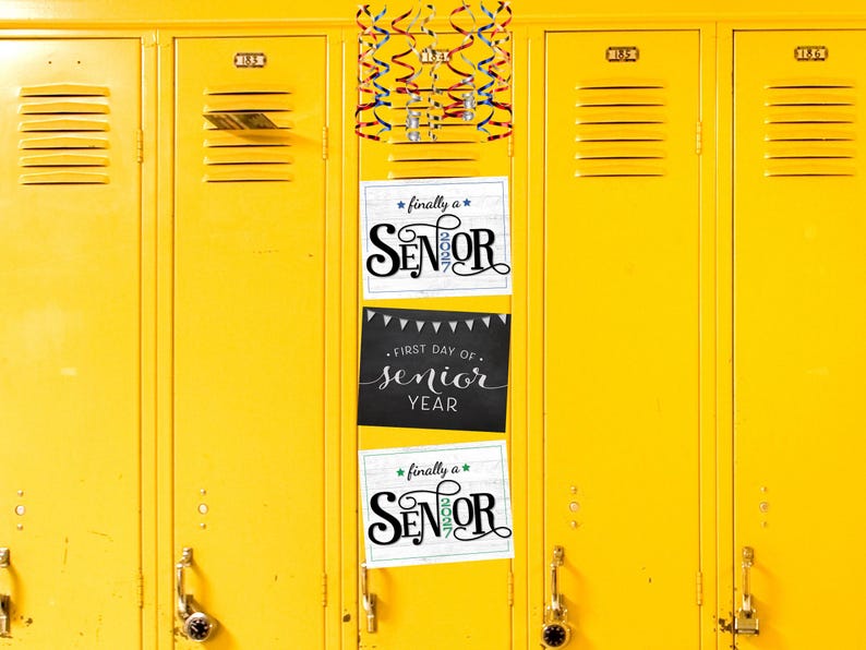 May include: A row of bright yellow metal school lockers with three stacked rectangular signs. The top and bottom signs feature the text finally a SENIOR 2027. The middle sign is black with white text reading FIRST DAY OF senior YEAR.