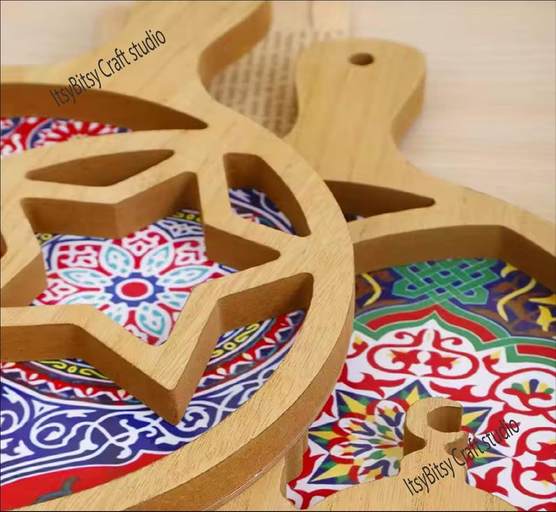 May include: Two wooden serving trays with intricate star-shaped cutouts. The trays are decorated with colorful geometric patterns and the text "Itsy Bitsy Craft studio" is visible on both trays.