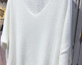 Crèmekleurige trui met glitterdetail