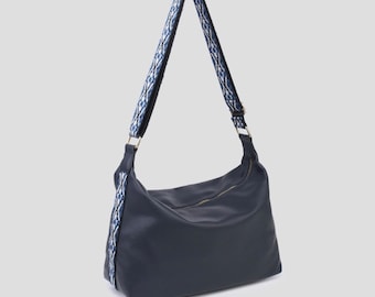 Navy blue shoulder bag with detailed strap