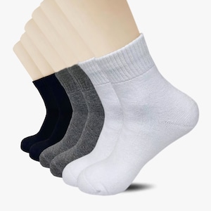 May include: A pack of six ankle socks in white, grey, and black. The socks are made from a soft, comfortable material and are ideal for everyday wear.