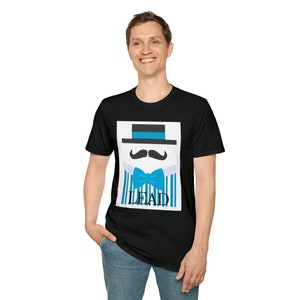 May include: Black t-shirt featuring a graphic of a hat, mustache, bow tie, and vertical stripes in shades of blue and white. The word "LEAD" is printed below the bow tie. The shirt is worn by a person.