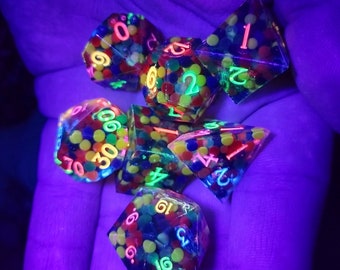 Set of 7 glow in the dark black light party rainbow polyhedral sharp edged dice