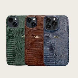 three different colored leather phone cases, each with a unique pattern and color.