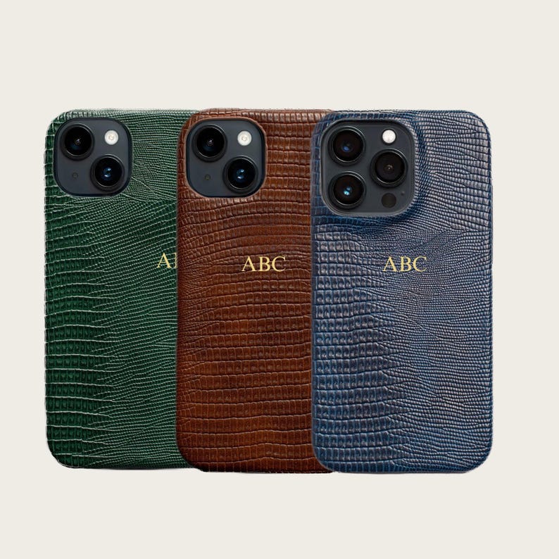 three different colored leather phone cases, each with a unique pattern and color.