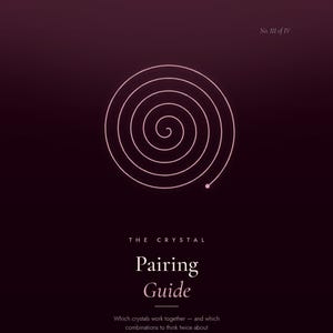 May include: A dark purple informational guide titled The Crystal Pairing Guide by D'eaun, featuring a light pink spiral graphic. The text reads Collective Essence Jewelry, No. III of IV, and Which crystals work together—and which combinations to think twice about.