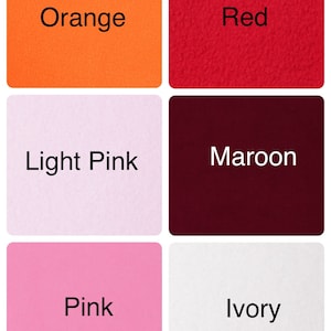 May include: Six fabric swatches in different colors: orange, red, light pink, maroon, pink, and ivory.