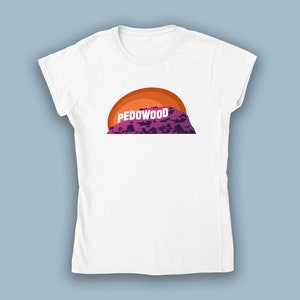May include: White t-shirt with a graphic of a purple mountain with a sunset behind it. The text "PEDOWOOD" is on the mountain.