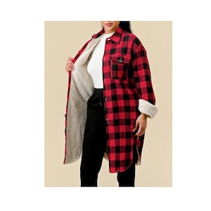 May include: A long-sleeved red and black plaid shirt with a white sherpa lining. The shirt has a button-down front and a relaxed fit.