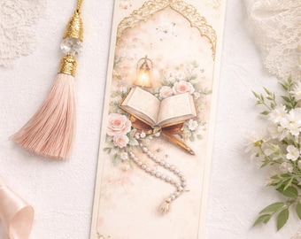 May include: A decorative bookmark featuring a detailed illustration of an open book, flowers, and a lantern. The bookmark has a gold tassel and a beaded chain. The color palette includes soft pinks, creams, and gold accents, creating an elegant aesthetic.