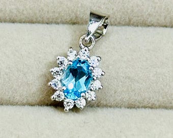 Handmade Sterling Silver Swiss Blue Topaz Pendant, Floral Halo