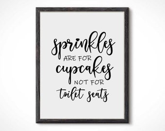 May include: A black and white printable sign with the text "Sprinkles are for cupcakes not for toilet seats".