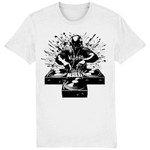 May include: White t-shirt with a black and white graphic of a DJ wearing headphones and using turntables. The word "WIZARD" is printed on the DJ's shirt, with a splash design in the background.