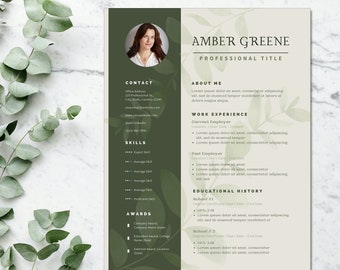 May include: A resume template with a green background and floral accents. The resume is for Amber Greene, who has a professional title. The resume includes contact information, skills, awards, work experience, and educational history.
