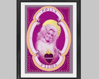 May include: A framed print of a portrait of Dolly Parton in a pink and gold frame. The portrait is set against a pink background with gold accents. The text "DOLLY PARTON" is written in gold lettering at the top and bottom of the frame.