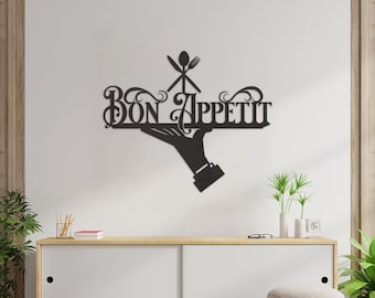 Puede incluir: Decoración de pared de metal negro con una mano sosteniendo una bandeja con las palabras "Bon Appetit" y un tenedor, un cuchillo y una cuchara.