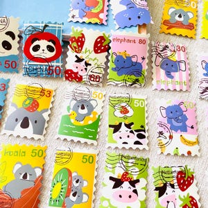 May include: A collection of rectangular postage stamps featuring colourful cartoon illustrations of animals including pandas, koalas, elephants, and cows, alongside fruits like strawberries and bananas, with various country names and numerical values printed on them.