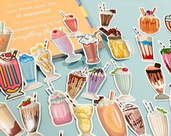 May include: A collection of colorful milkshake stickers with various toppings, including cherries, whipped cream, and chocolate syrup. The stickers are on a light blue background.