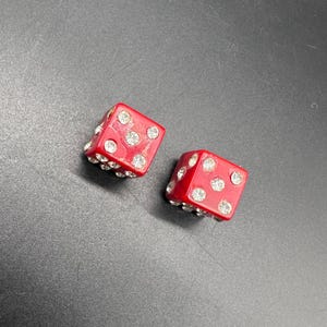 May include: A white ceramic mug with a black handle and the text "But First, Coffee" in a black, bold font. The mug is on a white surface. The mug is 4 inches tall.