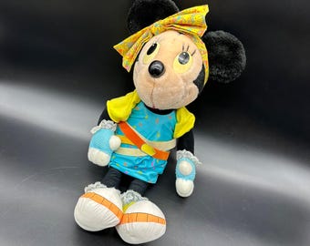 Muñeco de peluche vintage de Minnie Mouse, estilo retro de los años 80, con temática kitsch.