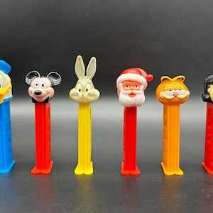 Vintage Pez Candy Dispensers Lot of 6 Mickey Bugs Santa Garfield Donald Duck Lucy