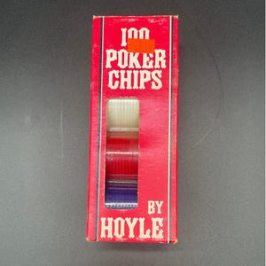 May include: A red box of 100 poker chips by Hoyle. The box has a window showing stacks of white, red, and blue chips. The text "100 POKER CHIPS" is in white, bold letters.