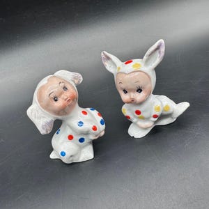 May include: A rustic wooden sign with the text "Welcome" in a handwritten style. The sign is painted white with a distressed finish, and features a decorative floral element in the corner. Perfect for a front door or entryway.